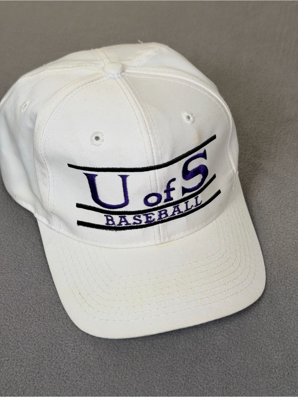 U of S Baseball Vintage Adult White w/Purple Embroidery Snap Back Adjustable Cap